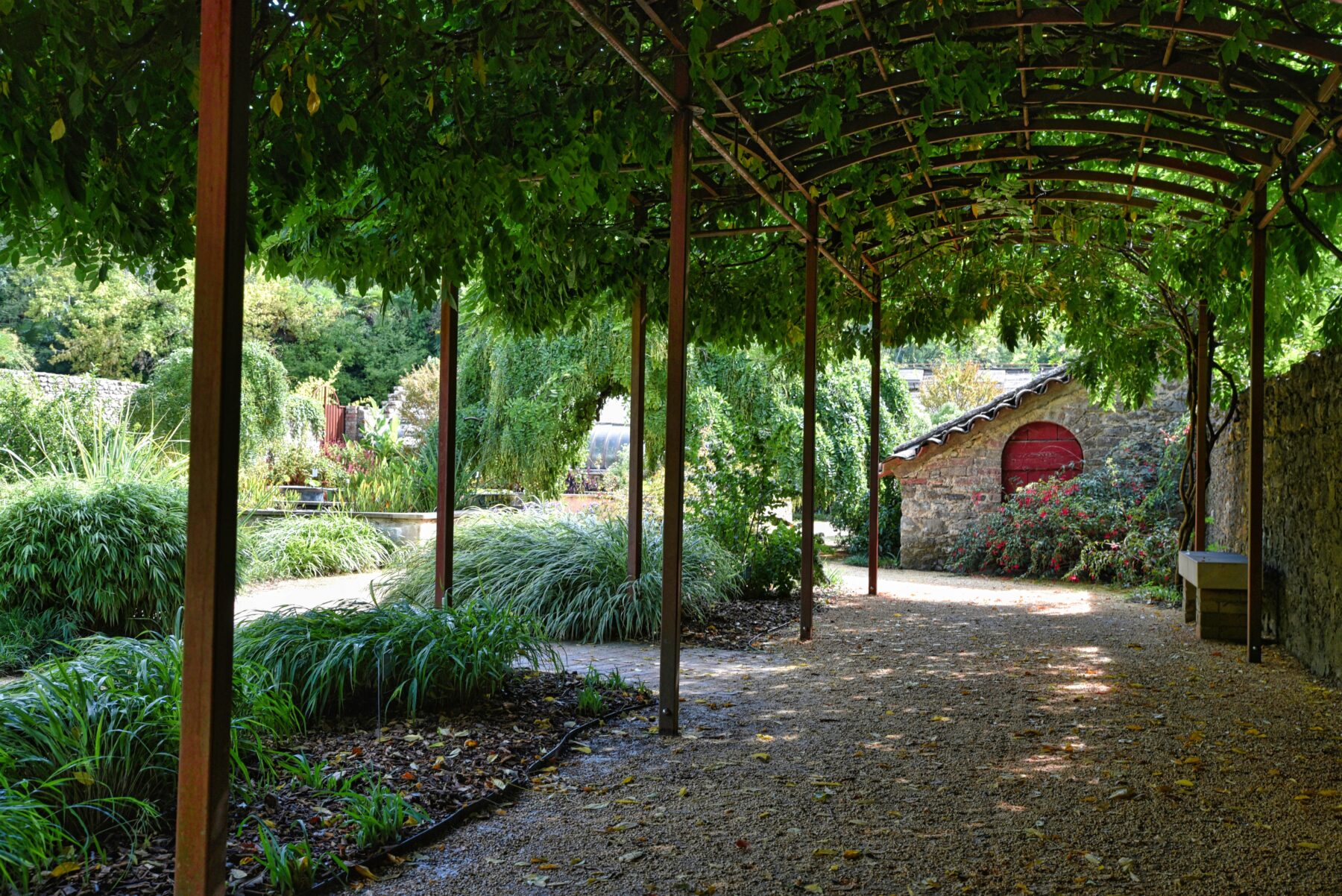 Gravel regulates runoff by disrupting the flow of water, enabling absorption rather than eroding soil. It reinforces surfaces, diffuses the force of rainfall, and introduces resistance that helps anchor loose material. However, its effectiveness is reliant on certain variables. Those being the gravel’s size, shape, and placement.